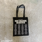 White screen printing on a black tote bag